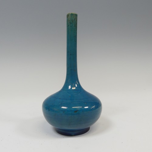 37 - A slender 19thC Chinese monochrome Vase, of blue coloration and globular bottle shape, raised on pot... 