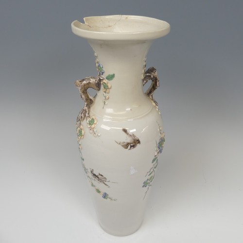 53 - An unusual Chinese blanc de chine prunus Vase, the plain body with twin handles in the form of prunu... 