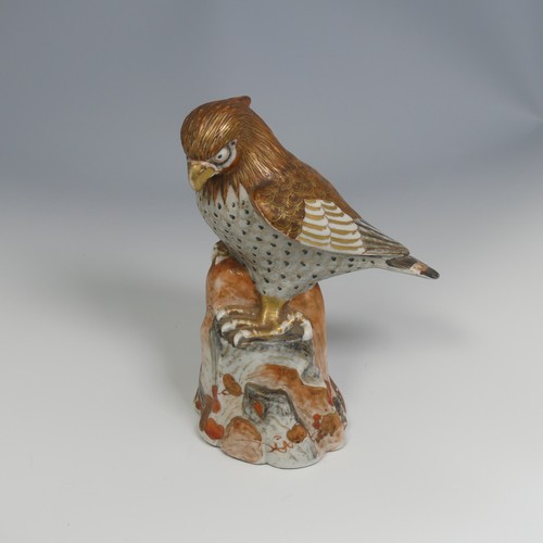 110 - A 19thC Japanese kutani porcelain sculpture of a Bird of Prey, decorated in the typical palette, six... 