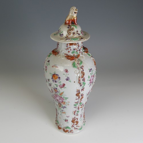 64 - A 19thC Chinese export porcelain slender baluster Vase, and cover, decorated in floral motifs with r... 