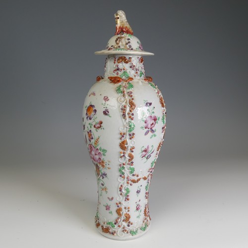 64 - A 19thC Chinese export porcelain slender baluster Vase, and cover, decorated in floral motifs with r... 