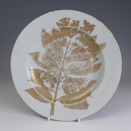 66 - An unusual 19thC Chinese export porcelain Plate, the plain ground with gilded foliate representation... 