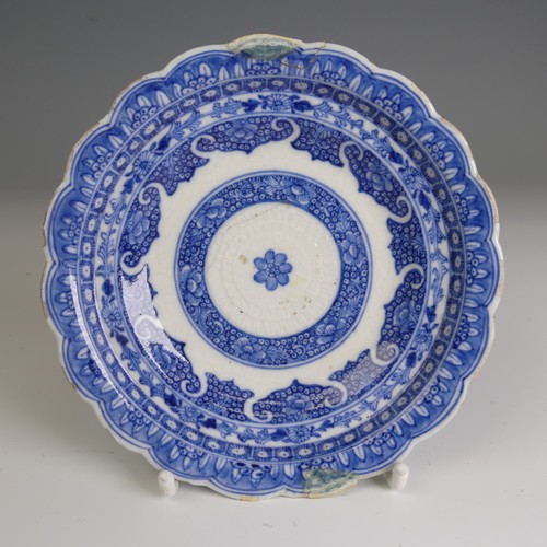 67 - An 18thC Chinese porcelain blue and white Saucer, finely decorated in foliage, D 13.8cm, together wi... 