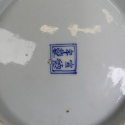 80 - An antique Chinese blue and white Charger, underglaze decorations of leaves and flowers, D 28cm, tog... 