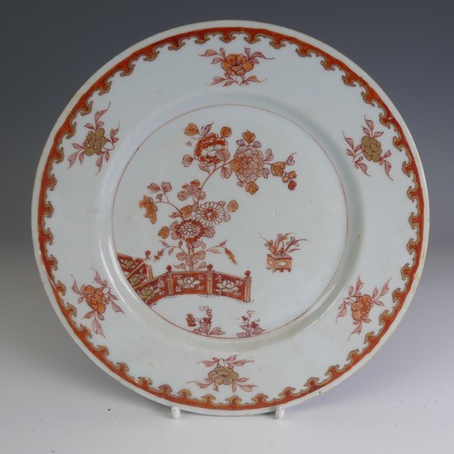 82 - A matched of 18thC Chinese export porcelain Plates, decorated in iron red flora, D 22cm, together wi... 