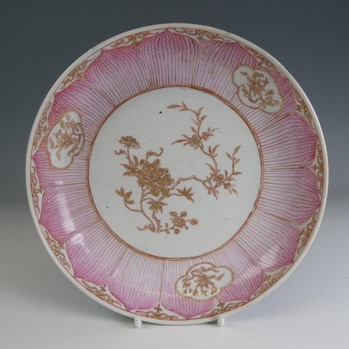 83 - An unusual 18thC Chinese famille rose Lotus Dish, with central iron red and gilded foliage contained... 