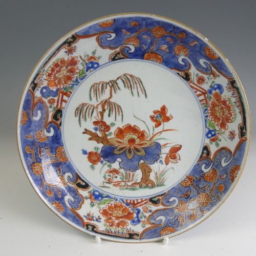 94 - A Republic period famille noir Plate, decorated in colourful floral enamels with six character iron ... 