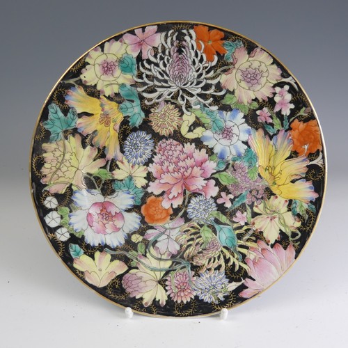 94 - A Republic period famille noir Plate, decorated in colourful floral enamels with six character iron ... 