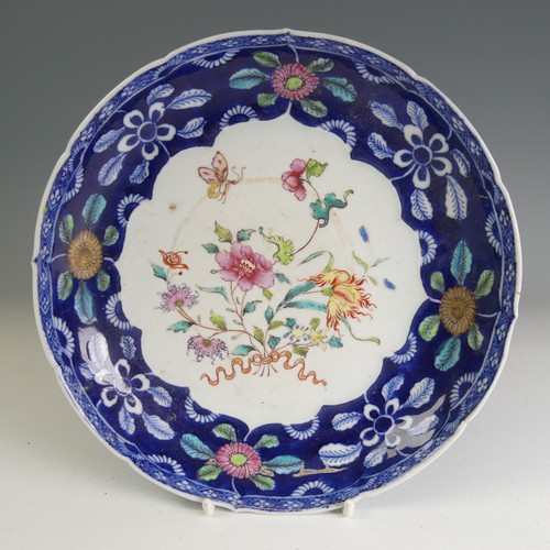 94 - A Republic period famille noir Plate, decorated in colourful floral enamels with six character iron ... 