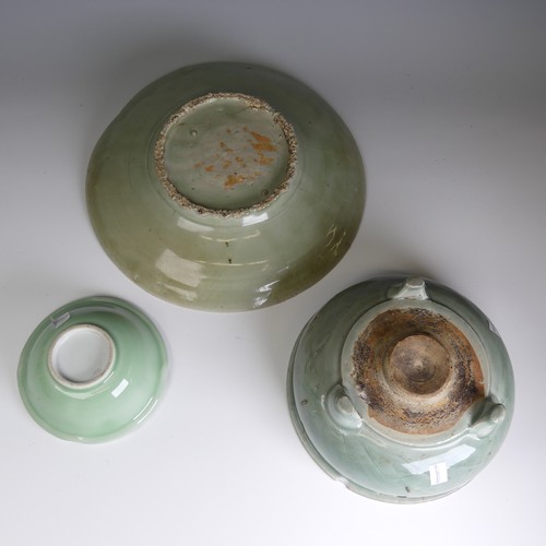 96 - A large antique Chinese celadon Charger, hairline cracks and firing fault to the foot, D 32cm, toget... 