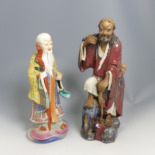 104 - A quantity of 20thC and earlier Chinese pottery and porcelain Figures, comprising a large well decor... 