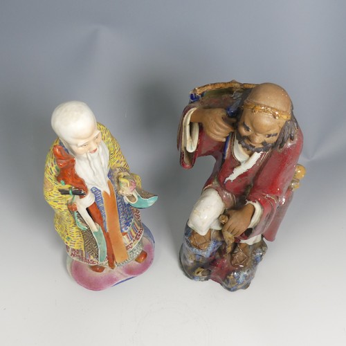 104 - A quantity of 20thC and earlier Chinese pottery and porcelain Figures, comprising a large well decor... 