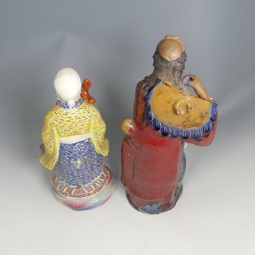 104 - A quantity of 20thC and earlier Chinese pottery and porcelain Figures, comprising a large well decor... 