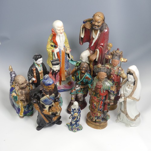 104 - A quantity of 20thC and earlier Chinese pottery and porcelain Figures, comprising a large well decor... 