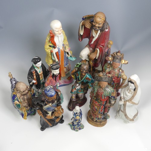 104 - A quantity of 20thC and earlier Chinese pottery and porcelain Figures, comprising a large well decor... 