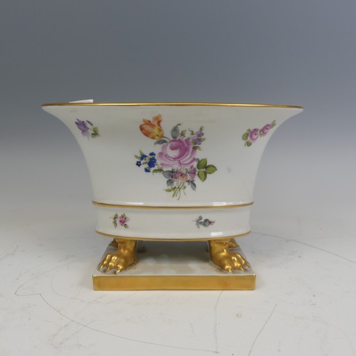 224 - A Herend hand painted porcelain oval Cachepot, painted with flowers and raised on gilt lion claw fee... 