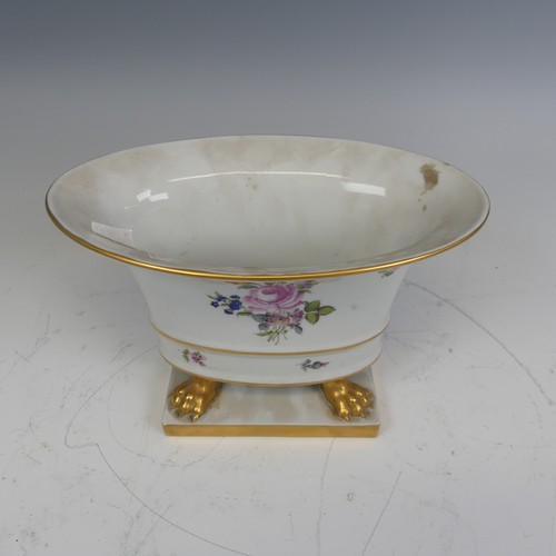 224 - A Herend hand painted porcelain oval Cachepot, painted with flowers and raised on gilt lion claw fee... 