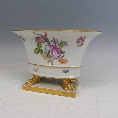 224 - A Herend hand painted porcelain oval Cachepot, painted with flowers and raised on gilt lion claw fee... 