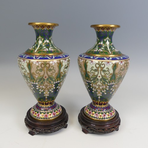 175 - A pair of 20thC Japanese cloisonne Vases, decorated with floral patterns and raised on carved stands... 