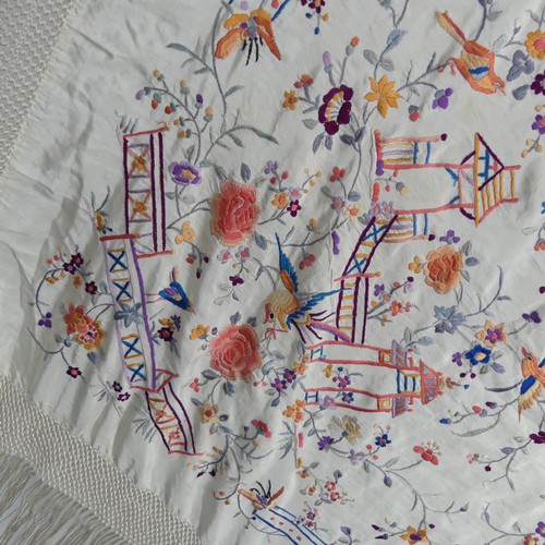 177 - An early 20th century silk embroidered Cantonese Piano Shawl, the cream ground with exotic birds and... 