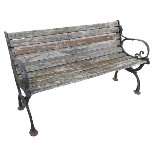 353 - An antique cast iron and teak Garden Seat /Bench, with scrolled supports, W 129.5 cm x H 74 cm x D 4... 