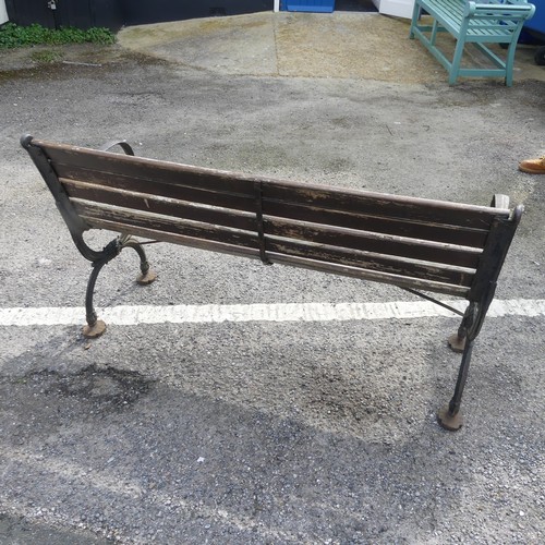 353 - An antique cast iron and teak Garden Seat /Bench, with scrolled supports, W 129.5 cm x H 74 cm x D 4... 