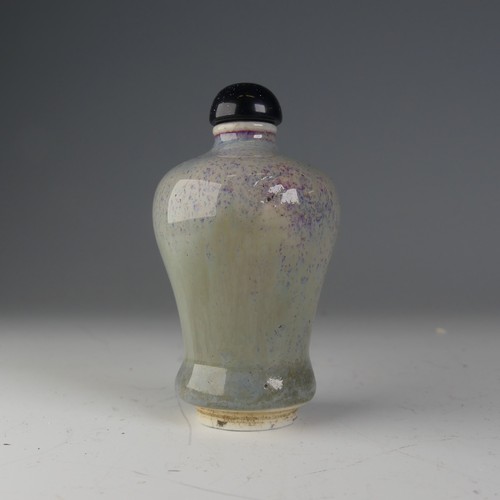 190 - A Chinese flambé porcelain Snuff Bottle, the glaze of blues and greys, raised on foot, H 7cm... 