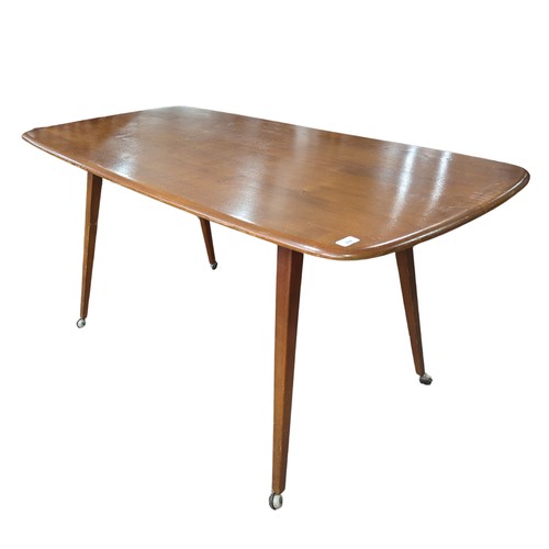 408 - A mid-20th century Ercol blond beech and elm refectory dining Table, circa 1960 model '755', having ... 