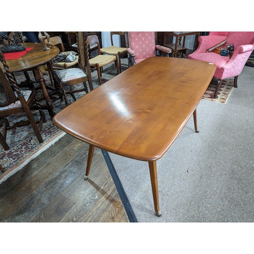 408 - A mid-20th century Ercol blond beech and elm refectory dining Table, circa 1960 model '755', having ... 