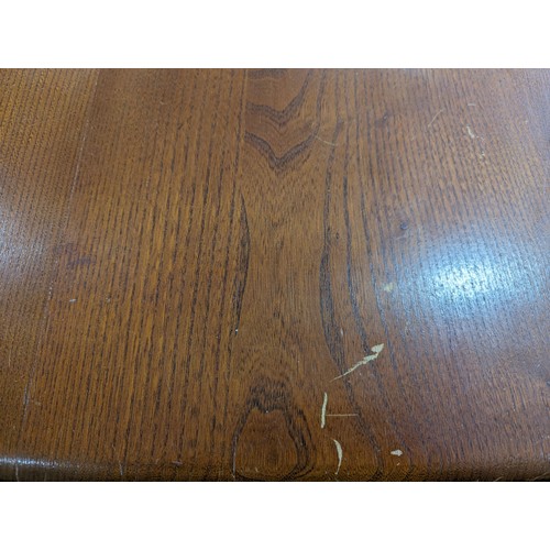 408 - A mid-20th century Ercol blond beech and elm refectory dining Table, circa 1960 model '755', having ... 