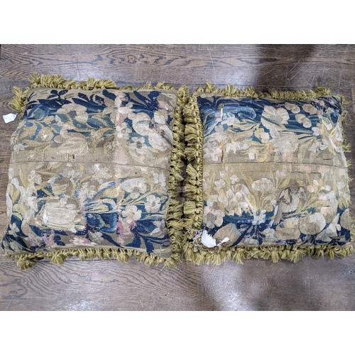 720 - A pair of antique woolwork tapestry Cushions, 61cm square (including tassels), tapestry repaired and... 