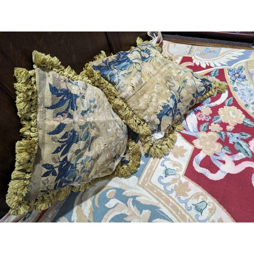 720 - A pair of antique woolwork tapestry Cushions, 61cm square (including tassels), tapestry repaired and... 