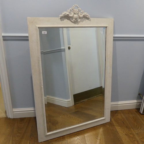 673 - A painted rectangular wall Mirror, with carved pediment and bevelled plate, W 85.5 cm x H 130 cm.... 