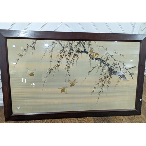 183 - A large early 20th century Japanese embroidered silk picture, depicting a branch with blossom and bi... 