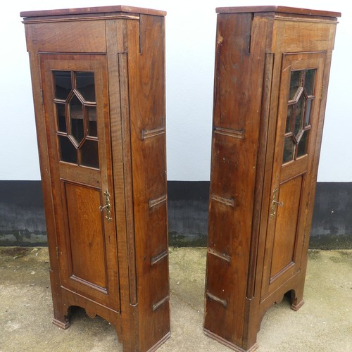 699 - A pair of oak early 20th century astral glazed hall Cabinets, missing central connecting shelves, W ... 