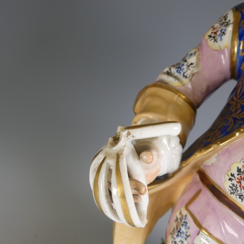 215 - A large 19thC Derby porcelain figure of Falstaff, decorated heavily, sword broken and chips elsewher... 