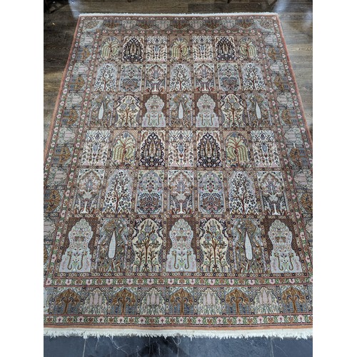 343 - Tribal Rugs; a finely hand-knotted Persian rug, wool and silk pile on cotton base, salmon pink groun... 