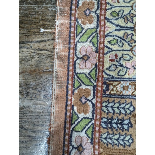 343 - Tribal Rugs; a finely hand-knotted Persian rug, wool and silk pile on cotton base, salmon pink groun... 