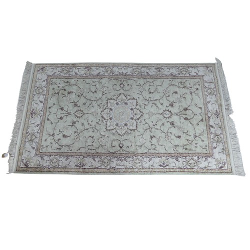 344 - Tribal Rugs; a hand-knotted Persian rug, cotton pile on cotton base, pale green ground, 152cm x 91cm... 