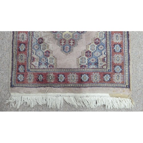 344 - Tribal Rugs; a hand-knotted Persian rug, cotton pile on cotton base, pale green ground, 152cm x 91cm... 