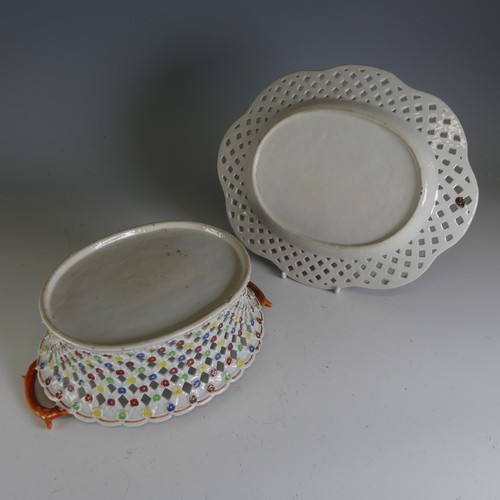 49 - A 19thC Chinese export porcelain reticulated Basket and associated Saucer, with interior painted flo... 