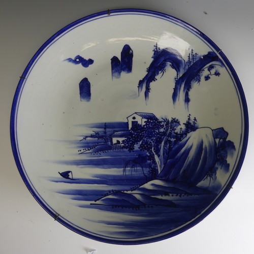 164 - An antique Japanese Arita porcelain Charger, un underglaze blue and white depiction of mountains, D ... 