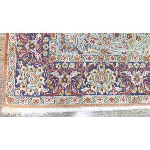 346 - Tribal Rugs; a finely hand-knotted Persian rug, wool and silk pile on cotton base, salmon pink groun... 