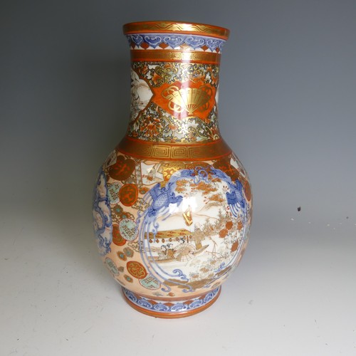 111 - An antique Japanese imari palette Vase, the underglaze blue profusely decorated with colourful medal... 