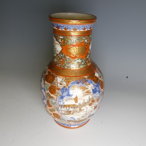 111 - An antique Japanese imari palette Vase, the underglaze blue profusely decorated with colourful medal... 