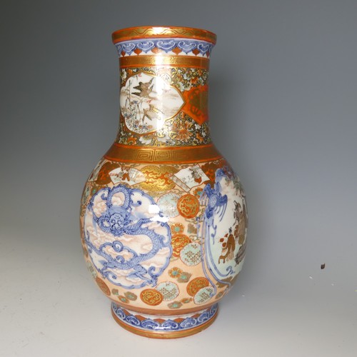 111 - An antique Japanese imari palette Vase, the underglaze blue profusely decorated with colourful medal... 