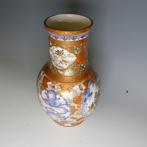 111 - An antique Japanese imari palette Vase, the underglaze blue profusely decorated with colourful medal... 