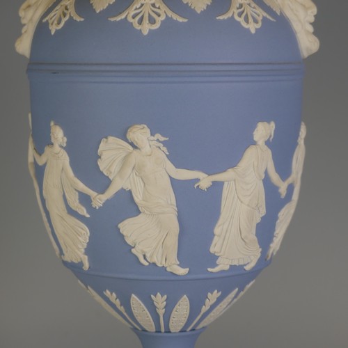 247 - A Wedgwood Jasperware twin-handled Urn, with 'Dancing Hours' decoration and Bacchus mask handles, do... 