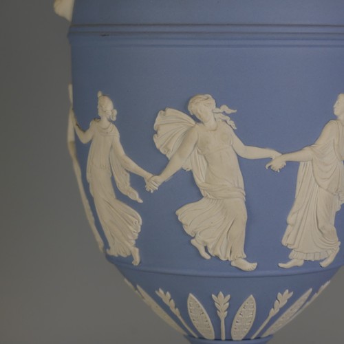 247 - A Wedgwood Jasperware twin-handled Urn, with 'Dancing Hours' decoration and Bacchus mask handles, do... 