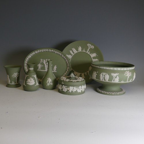 249 - A large quantity of Wedgwood green Jasperware, including pedestal bowl, trinket boxes, vases, etc., ... 